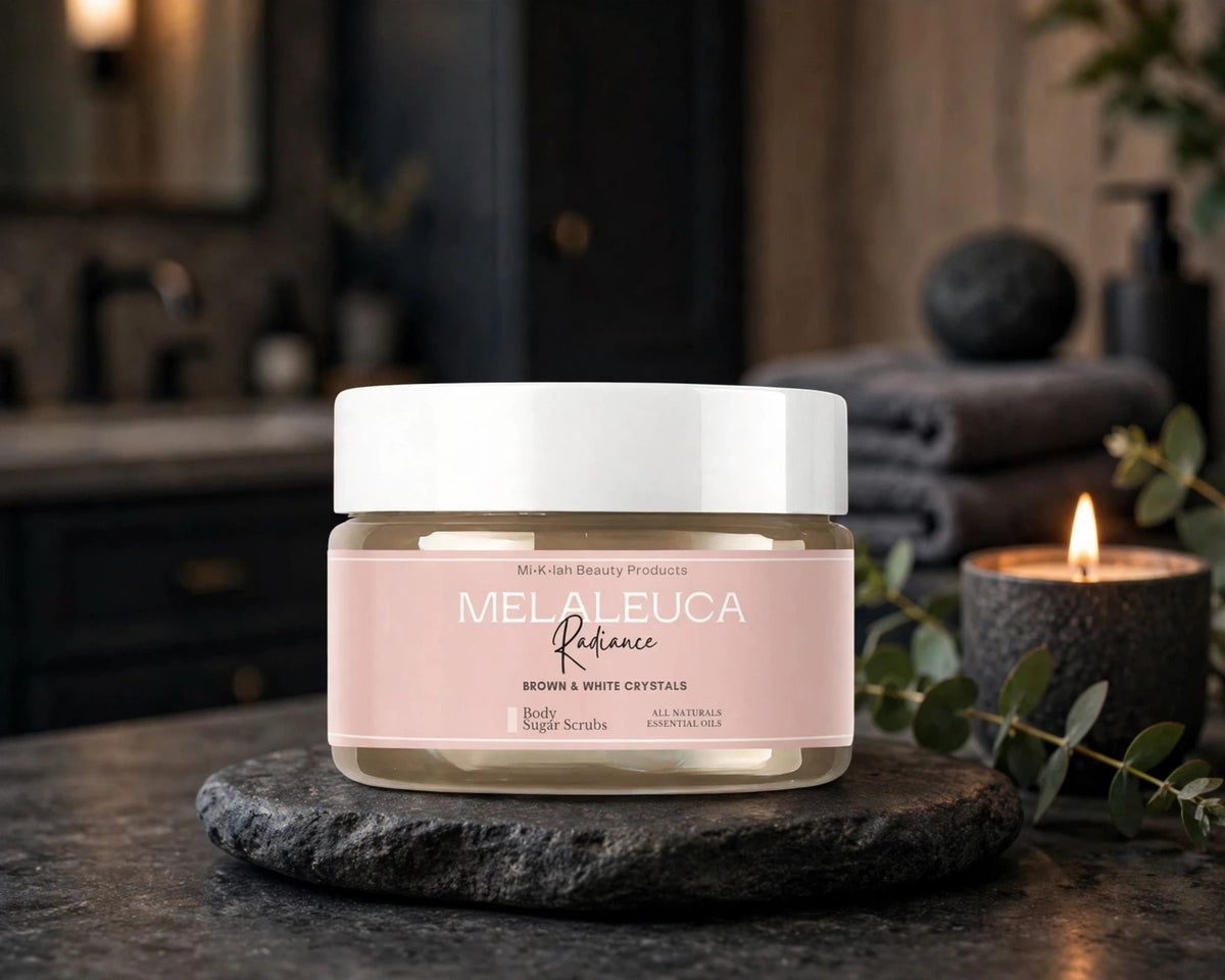 Melaleuca body sugar scrub jar on a charcoal stone vanity | Miklahgiftsets